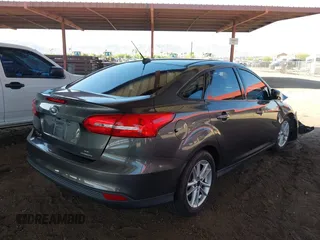 2015 Ford Focus SE z VIN 1FADP3F21FL210742, wystawiony jako IAAI lot #42418476 z przebiegiem 155 829 mil mil oraz . Historia ofert i sprzedaży dostępna na DreamBid. Obrazek 4.