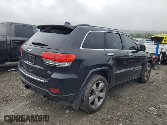 2015 Jeep Grand Cherokee Overland with VIN 1C4RJFCT2FC762573, listed as a Copart auction lot 59123275 with 229,128 mi miles and Salvage title. Bid and sale history available at DreamBid. Image 3.