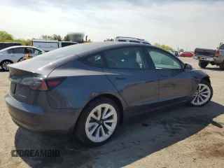 2023 Tesla Model 3 Long Range with VIN 5YJ3E1EB2PF389041, listed as a Copart auction lot 53450725 with 27,060 mi miles and Salvage Title. Bid and sale history available at DreamBid. Image 3.