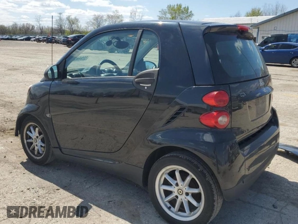 2009 Smart fortwo Pure z VIN WMEEJ31X49K219479, wystawiony jako Copart lot #52446625 z przebiegiem 82 337 mil mil oraz Szkody całkowita. Historia ofert i sprzedaży dostępna na DreamBid. Obrazek 2.