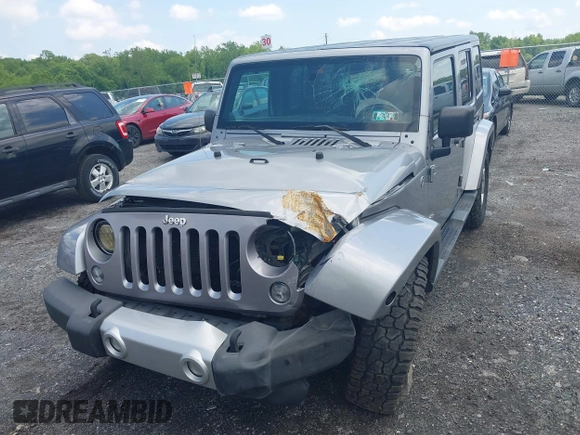 2014 Jeep Wrangler Unlimited Sahara z VIN 1C4BJWEG0EL129229, wystawiony jako IAAI lot #42380976 z przebiegiem 175 735 mil mil oraz . Historia ofert i sprzedaży dostępna na DreamBid. Obrazek 12.