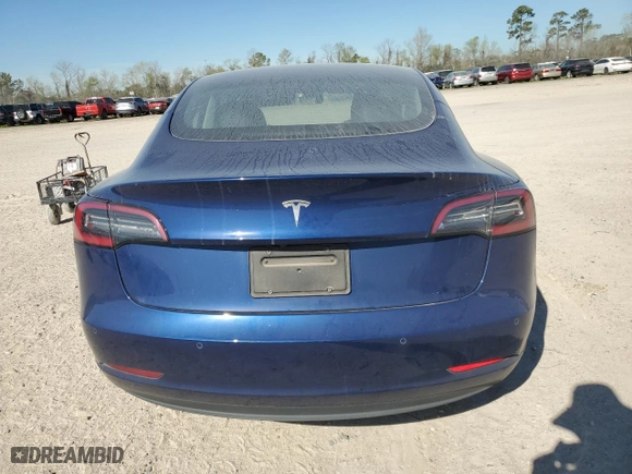 2021 Tesla Model 3 Standard Range Plus with VIN 5YJ3E1EA9MF057665, listed as a Copart auction lot 48671805 with 33,241 mi miles and Clean Title. Bid and sale history available at carsss.com. Image 6.