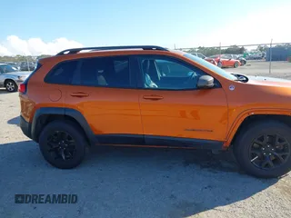 2014 Jeep Cherokee Trailhawk with VIN 1C4PJMBS4EW254879, listed as a IAAI auction lot 41550356 with 101,077 mi miles. Bid and sale history available at carsss.com. Image 14.