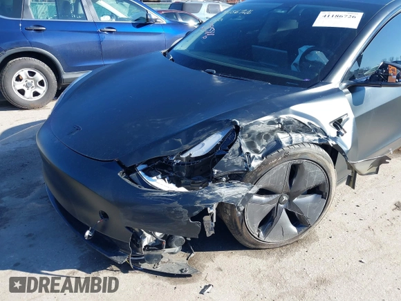 2020 Tesla Model 3 Standard Range Plus with VIN 5YJ3E1EA4LF745491, listed as a IAAI auction lot 41186726 with 74,575 mi miles and . Bid and sale history available at DreamBid. Image 19.