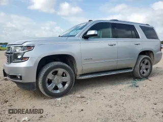 2015 Chevrolet Tahoe LTZ with VIN 1GNSCCKC0FR182996, listed as a Copart auction lot 59557745 with 256,644 mi miles and Salvage title. Bid and sale history available at DreamBid. Image 1.