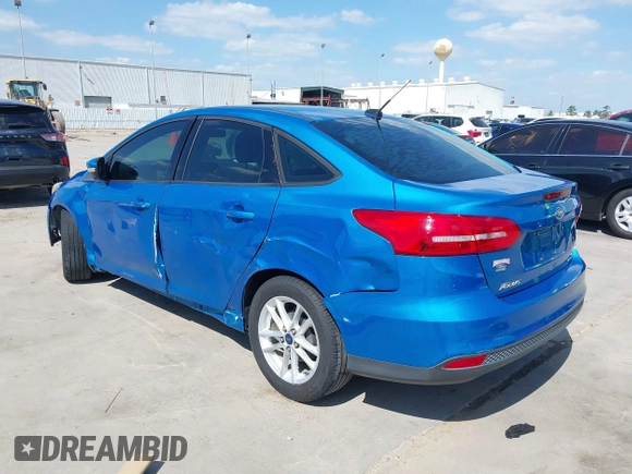 2015 Ford Focus SE with VIN 1FADP3F21FL379837, listed as a IAAI auction lot 42021623 with 146,571 mi miles. Bid and sale history available at carsss.com. Image 3.