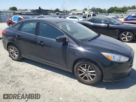 2018 Ford Focus SE with VIN 1FADP3FE8JL205699, listed as a Copart auction lot 63300795 with 128,877 mi miles and Clean title. Bid and sale history available at DreamBid. Image 4.