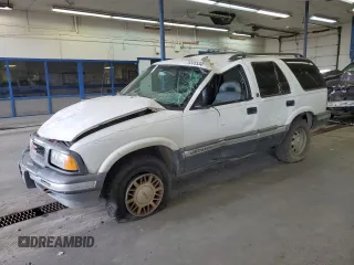 1996 GMC Jimmy SL with VIN 1GKDT13W4T2572197, listed as a Copart auction lot 76535534 with 157,624 mi miles and Salvage Title. Bid and sale history available at carsss.com. Image 1.