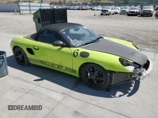 1999 Porsche Boxster with VIN WP0CA2987XU622760, listed as a Copart auction lot 59898355 with 104,425 mi miles and Salvage title. Bid and sale history available at DreamBid. Image 4.