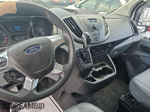 2015 Ford Transit Cargo with VIN 1FTNE1YM6FKA69972, listed as a IAAI auction lot 42145294 with 126,825 mi miles. Bid and sale history available at carsss.com. Image 1.