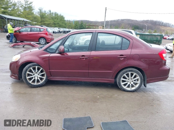 2008 Suzuki SX4 Sport z VIN JS2YC414985100007, wystawiony jako IAAI lot #41849082 z przebiegiem 157 595 mil mil oraz . Historia ofert i sprzedaży dostępna na DreamBid. Obrazek 14.