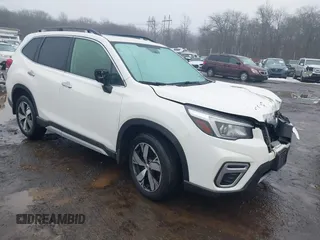2019 Subaru Forester Touring with VIN JF2SKAWC3KH555900, listed as a IAAI auction lot 41558281 with 138,351 mi miles. Bid and sale history available at carsss.com. Image 1.
