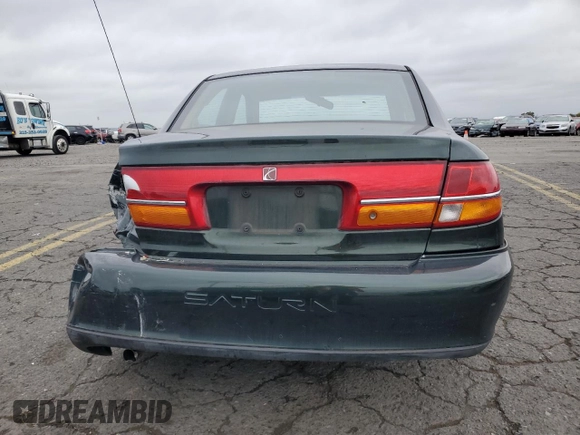 2001 Saturn LS z VIN 1G8JU54F41Y581083, wystawiony jako Copart lot #73123714 z przebiegiem 98 500 mil mil oraz Szkody całkowita. Historia ofert i sprzedaży dostępna na DreamBid. Obrazek 6.