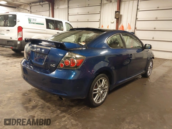 2009 Scion tC with VIN JTKDE167990297921, listed as a IAAI auction lot 41720687 with 159,960 mi miles. Bid and sale history available at carsss.com. Image 4.