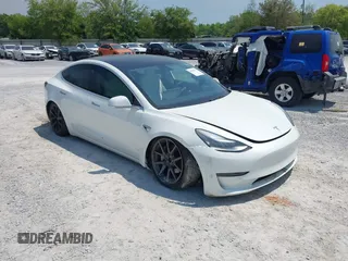 2019 Tesla Model 3 Long Range with VIN 5YJ3E1EB4KF494432, listed as a IAAI auction lot 42009327 with 121,954 mi miles and . Bid and sale history available at DreamBid. Image 1.