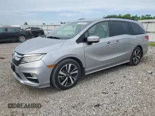2018 Honda Odyssey Elite with VIN 5FNRL6H91JB058352, listed as a Copart auction lot 56902935 with 104,699 mi miles and Salvage title. Bid and sale history available at DreamBid. Image 1.