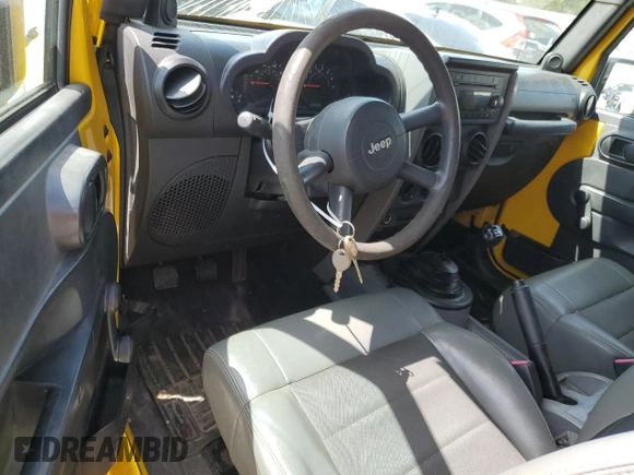 2009 Jeep Wrangler X with VIN 1J4FA241X9L765664, listed as a Copart auction lot 51802065 with 137,053 mi miles and Salvage Title. Bid and sale history available at DreamBid. Image 8.
