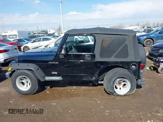2002 Jeep Wrangler X with VIN 1J4FA39S52P770664, listed as a IAAI auction lot 41661580 with 122,445 mi miles. Bid and sale history available at carsss.com. Image 14.