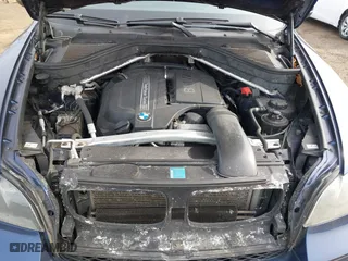 2011 BMW X5 35i with VIN 5UXZV4C56BL412415, listed as a IAAI auction lot 41611847 with 141,848 mi miles. Bid and sale history available at carsss.com. Image 10.