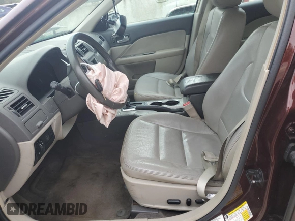 2012 Ford Fusion SEL z VIN 3FAHP0JA5CR184593, wystawiony jako Copart lot #61647265 z przebiegiem 127 720 mil mil oraz Szkoda całkowita • Salvage title. Historia ofert i sprzedaży dostępna na DreamBid. Obrazek 7.