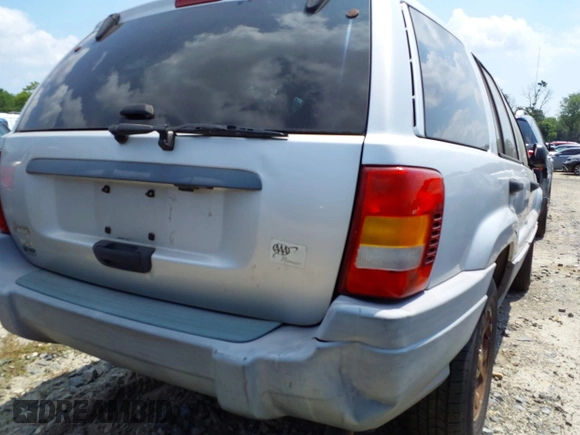2002 Jeep Grand Cherokee Laredo with VIN 1J4GW48SX2C313093, listed as a IAAI auction lot 42446559 with 200,319 mi miles and . Bid and sale history available at DreamBid. Image 18.