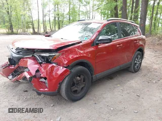 2016 Toyota RAV4 LE with VIN JTMZFREV4GJ062701, listed as a IAAI auction lot 42084694 with 121,553 mi miles and . Bid and sale history available at DreamBid. Image 2.
