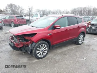 2017 Ford Escape Titanium with VIN 1FMCU9J95HUA48807, listed as a IAAI auction lot 41522636 with 218,342 mi miles. Bid and sale history available at carsss.com. Image 2.