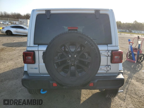2024 Jeep Wrangler Sahara with VIN 1C4RJXP60RW128448, listed as a Copart auction lot 48658135 with 5,879 mi miles and Salvage Title. Bid and sale history available at DreamBid. Image 6.