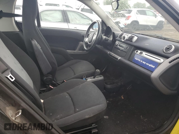 2013 Smart fortwo Pure z VIN WMEEJ3BA2DK663432, wystawiony jako Copart lot #63203755 z przebiegiem 79 786 mil mil oraz Czysty tytuł • Clean title. Historia ofert i sprzedaży dostępna na DreamBid. Obrazek 10.