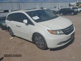 2016 Honda Odyssey Touring Elite with VIN 5FNRL5H98GB102544, listed as a IAAI auction lot 42040050 with 128,957 mi miles and . Bid and sale history available at DreamBid. Image 1.