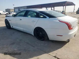 2014 Jaguar XJ Supercharged z VIN SAJWA1GT4EMV60053, wystawiony jako Copart lot #57643005 z przebiegiem 48 139 mil mil oraz Szkoda całkowita • Salvage title. Historia ofert i sprzedaży dostępna na DreamBid. Obrazek 2.