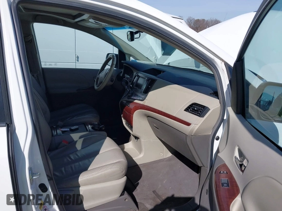 2011 Toyota Sienna XLE AAS with VIN 5TDYK3DCXBS043733, listed as a IAAI auction lot 41601544 with 221,658 mi miles and . Bid and sale history available at DreamBid. Image 5.