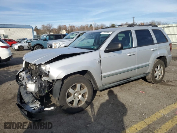 2009 Jeep Grand Cherokee Laredo with VIN 1J8HR48P89C552691, listed as a Copart auction lot 82080964 with 100,876 mi miles and Salvage Title. Bid and sale history available at carsss.com. Image 1.