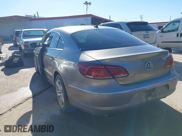 2014 Volkswagen CC Sport with VIN WVWBN7AN1EE518559, listed as a IAAI auction lot 41208853 with 154,957 mi miles. Bid and sale history available at carsss.com. Image 3.