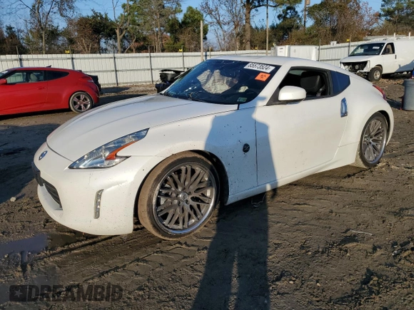 2014 Nissan 370Z Touring with VIN JN1AZ4EH8EM631324, listed as a Copart auction lot 85573524 with 0 mi miles and Salvage Title. Bid and sale history available at carsss.com. Image 1.