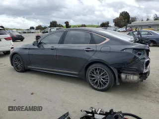 2018 Genesis G80 Sport with VIN KMHGN4JB2JU262468, listed as a Copart auction lot 50961045 with 100,118 mi miles and Salvage title. Bid and sale history available at DreamBid. Image 2.