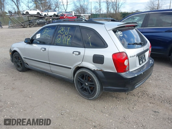 2002 Mazda Protege with VIN JM1BJ245921455563, listed as a IAAI auction lot 42064853 with Not Provided miles and . Bid and sale history available at DreamBid. Image 3.