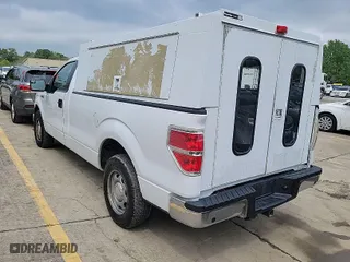 2014 Ford F-150 XL with VIN 1FTMF1CM5EKG22867, listed as a IAAI auction lot 42000275 with 200,657 mi miles. Bid and sale history available at carsss.com. Image 1.