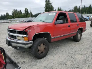 1999 Chevrolet Tahoe Z71 with VIN 1GNEK13R4XR148598, listed as a Copart auction lot 60969265 with 163,512 mi miles and Salvage title. Bid and sale history available at DreamBid. Image 1.