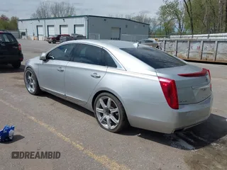 2013 Cadillac XTS Luxury z VIN 2G61P5S3XD9178601, wystawiony jako IAAI lot #42154859 z przebiegiem 111 227 mil mil oraz . Historia ofert i sprzedaży dostępna na DreamBid. Obrazek 3.