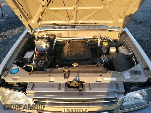 2002 Isuzu Trooper S z VIN JACDS58X627J11588, wystawiony jako Copart lot #76932404 z przebiegiem Nie podano mil oraz Szkody całkowita. Historia ofert i sprzedaży dostępna na DreamBid. Obrazek 12.