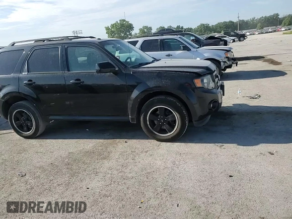 2011 Ford Escape XLT с VIN 1FMCU9DG5BKB65171, выставлен на аукционе Copart как лот 63237785 с пробегом 195 141 миль миль и Списание • Salvage title. История ставок и продаж доступна на DreamBid. Изображение 14.