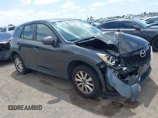 2014 Mazda CX-5 Sport with VIN JM3KE2BE0E0411377, listed as a IAAI auction lot 42143229 with 137,384 mi miles and . Bid and sale history available at carsss.com. Image 1.