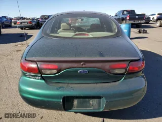 1999 Ford Taurus SE with VIN 1FAFP53U6XA242920, listed as a Copart auction lot 77883994 with 115,000 mi miles and Salvage Title. Bid and sale history available at carsss.com. Image 6.