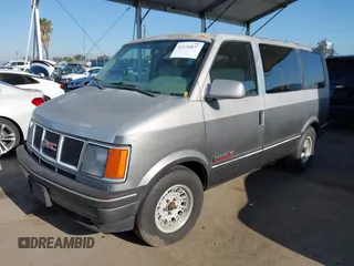 1991 GMC Safari z VIN 1GKDM19Z2MB530997, wystawiony jako IAAI lot #42134837 z przebiegiem 195 085 mil mil oraz . Historia ofert i sprzedaży dostępna na DreamBid. Obrazek 2.