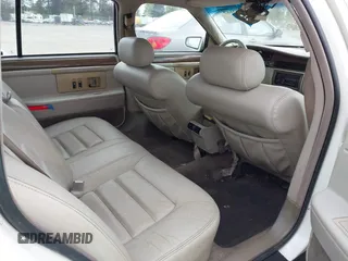 1995 Cadillac DeVille z VIN 1G6KD52B1SU278042, wystawiony jako IAAI lot #42142667 z przebiegiem 79 943 mil mil oraz . Historia ofert i sprzedaży dostępna na DreamBid. Obrazek 8.