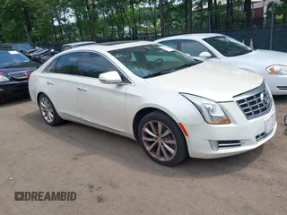 2013 Cadillac XTS Premium z VIN 2G61S5S32D9118178, wystawiony jako IAAI lot #42494846 z przebiegiem 128 970 mil mil oraz . Historia ofert i sprzedaży dostępna na DreamBid. Obrazek 1.