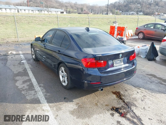 2013 BMW 3 Series 320i with VIN WBA3B1C58DK129051, listed as a IAAI auction lot 41119380 with 101,427 mi miles. Bid and sale history available at carsss.com. Image 3.