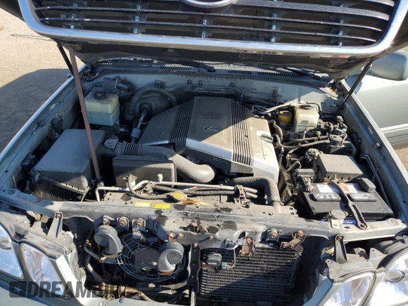 2002 Lexus LX 470 z VIN JTJHT00W723519186, wystawiony jako Copart lot #70190464 z przebiegiem 306 793 mil mil oraz Tytuł czysty. Historia ofert i sprzedaży dostępna na DreamBid. Obrazek 12.