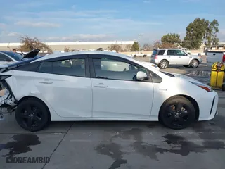 2021 Toyota Prius L Eco with VIN JTDKAMFU9M3131228, listed as a IAAI auction lot 41257117 with 72,840 mi miles. Bid and sale history available at carsss.com. Image 14.